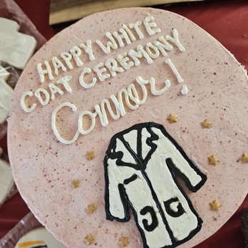 Foolish Owl Bakery - a pink cake with white frosting - Bakeries Near Me Foolish Owl Bakery - a pink cake with white frosting - Bakeries Near Me