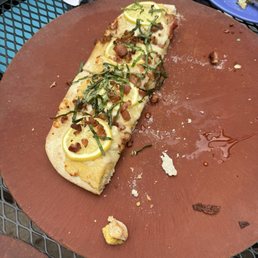 This dish here was a hummus lemon basil on a pita bread With a drizzle of honey This dish here was a hummus lemon basil on a pita bread With a drizzle of honey