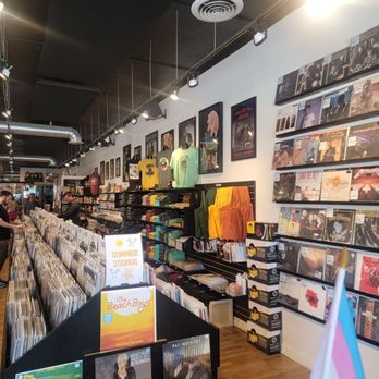 Paradise Found Records & Music - Perusing with the kid - Vinyl Records Near Me - Boulder, Colorado