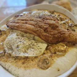 The Southern Cafe - Catfish filet l, creole style grits with Cajun shrimp...