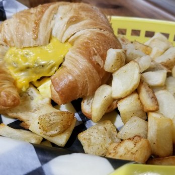 Dead Armadillos Tarmac Tavern - a croissant sandwich and fries - American Near Me - Tulsa, Oklahoma