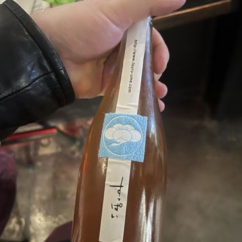 Bottle Bar East - a person holding a bottle of beer - Beer, Wine & Spirits Near Me - Philadelphia, Pennsylvania