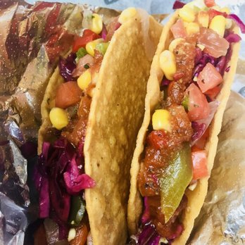 Condado Tacos - Chicken tacos with corn salsa, fajita peppers + sautéed onions, red cabbage, and chipotle honey sauce - Tacos Near Me - Indianapolis, Indiana Condado Tacos - Chicken tacos with corn salsa, fajita peppers + sautéed onions, red cabbage, and chipotle honey sauce - Tacos Near Me - Indianapolis, Indiana