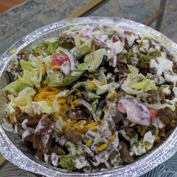 Rice platter with lamb - fully loaded with green and white sauce Rice platter with lamb - fully loaded with green and white sauce