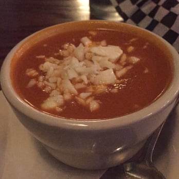 The Tipsy Cow - Tomato soup, topped with cheese curds - Bars Near Me - Madison, Wisconsin