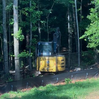 Septic Solutions Of Oconee - Machine digging and clearing area to install septic extension lines. - Septic Services Near Me - Statham, Georgia Septic Solutions Of Oconee - Machine digging and clearing area to install septic extension lines. - Septic Services Near Me - Statham, Georgia