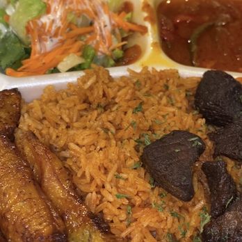 Steaming Pots - Jollof Rice with fried beef , plantains and side salad and side sauce witch was perfect to go on jollof rice - African Near Me - Tampa, Florida Steaming Pots - Jollof Rice with fried beef , plantains and side salad and side sauce witch was perfect to go on jollof rice - African Near Me - Tampa, Florida