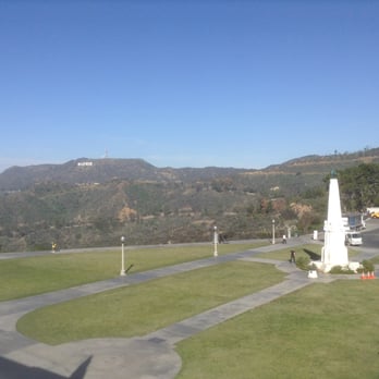 Griffith Observatory - view from the top of the observatory, looking back at the Hollywood sign and parking lot. the other way, there's a nice view of the city - Observatories Near Me - Los Angeles, California Griffith Observatory - view from the top of the observatory, looking back at the Hollywood sign and parking lot. the other way, there's a nice view of the city - Observatories Near Me - Los Angeles, California