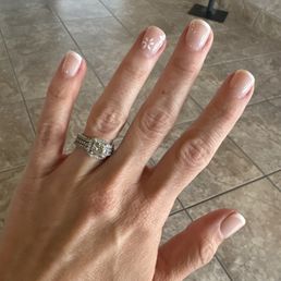 Dip French manicure with flower detail. Dip French manicure with flower detail.