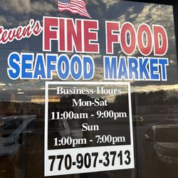 Steven's Fine Food & Seafood Market - Store front, business hours, and phone number.
