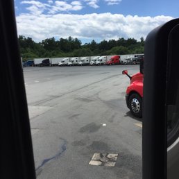Trucks in parking spots at the travel center.