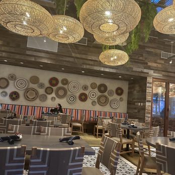 Baresco - a dining area with tables and chairs - Mexican Near Me - Pompano Beach, Florida