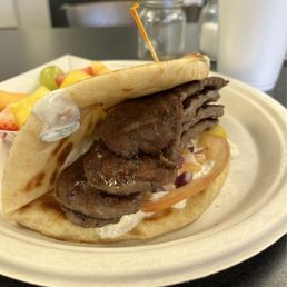 Gyro with a side of fresh fruit. Gyro with a side of fresh fruit.