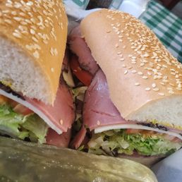 Roast beef sandwich with a side of pickle.  yummo