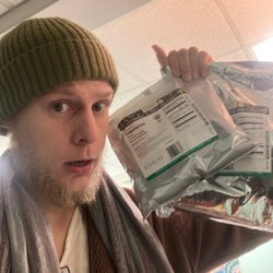 Sacred Vibes Wholistic Center - Narada our yoga & breathwork facilitator, checking out the new organic herb shipment where we make custom tea blends.