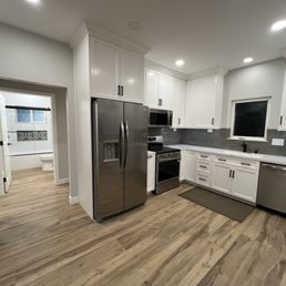 Kitchen with a view into the guest bathroom