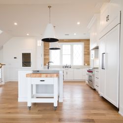 Signature Kitchens - Custom kitchen remodel: white shaker cabinets, large island with smaller moveable island