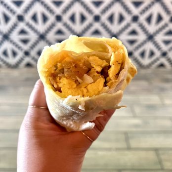 Lupe's Mexican Eatery - Dolphins Burrito. Bacon, sausage slices, hash browns, scrambled eggs, cheddar cheese, and sour cream. - Mexican Near Me - Dana Point, California Lupe's Mexican Eatery - Dolphins Burrito. Bacon, sausage slices, hash browns, scrambled eggs, cheddar cheese, and sour cream. - Mexican Near Me - Dana Point, California