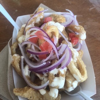 Peru Power - Jalea bowl, calamari, red onion, fried fish, tomato, and fried yuca. - Food Trucks Near Me Peru Power - Jalea bowl, calamari, red onion, fried fish, tomato, and fried yuca. - Food Trucks Near Me