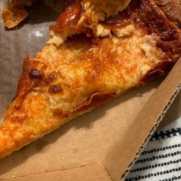 a slice of pizza in a box