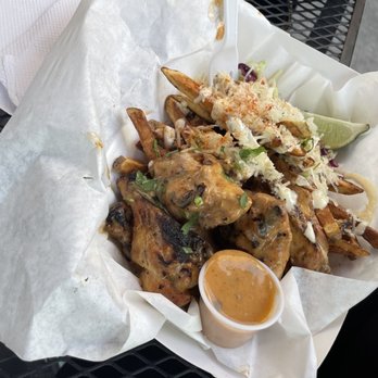 Mother Cluckers - a basket of food on a table - Food Trucks Near Me - Niagara Falls, New York Mother Cluckers - a basket of food on a table - Food Trucks Near Me - Niagara Falls, New York