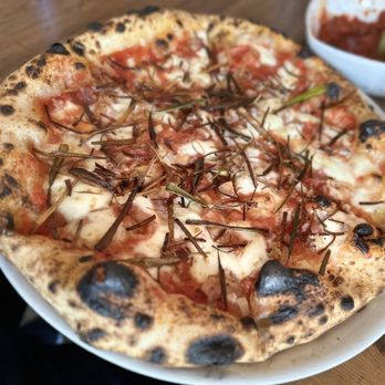 Dellarocco's - Donna Amatrice pie which has fried leeks and pancetta.  Such a great combo of flavor. - Pizza Near Me - Brooklyn, New York