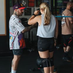 Black Iron Athletics - Our Owner & Head Coach working with another one of our Coaches during her workout.
