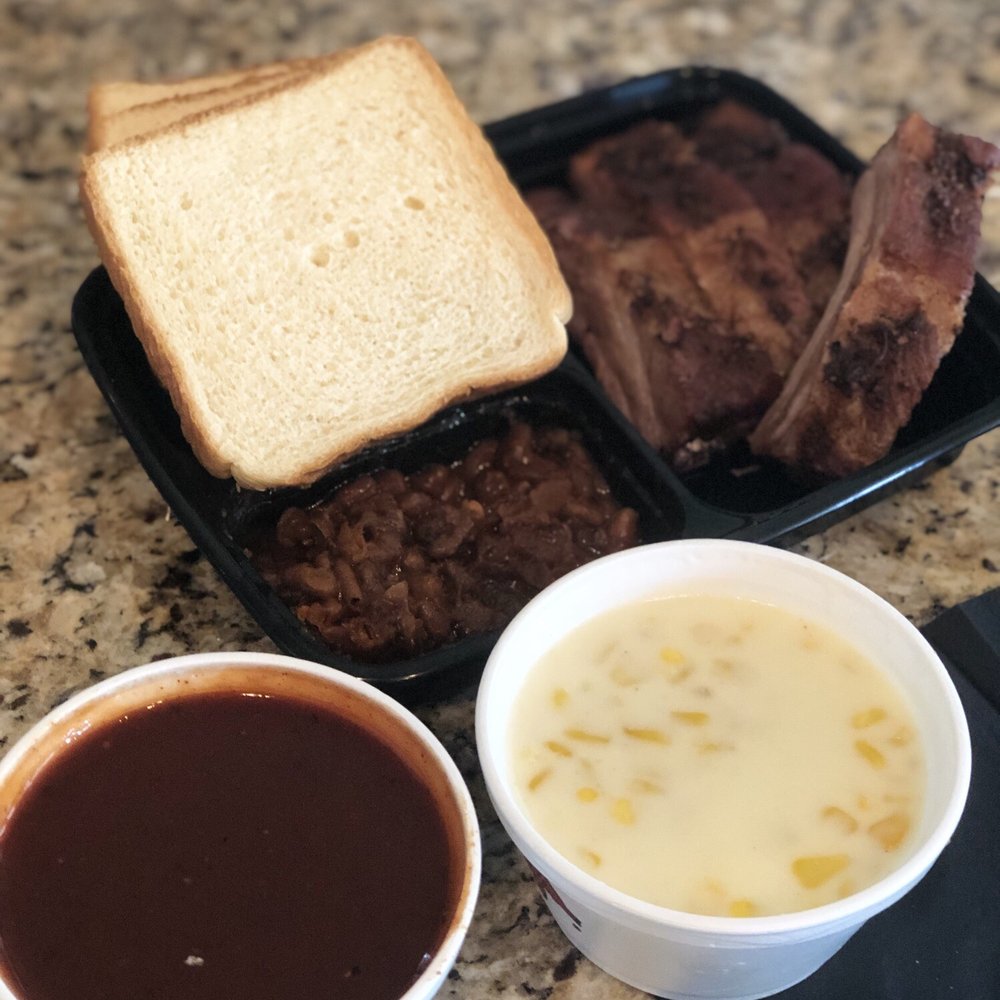 Rudy's - 1/2 lb babyback ribs and cream corn, beans were mine... underrated for $12.21... - Barbeque Near Me - Schertz, Texas