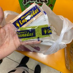 a person holding a bag of chips