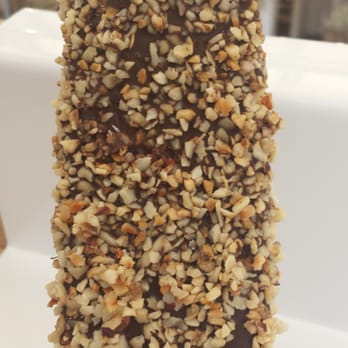 Popbar - Hazelnut pop Gelato bar fully dipped in Dark Chocolate with Hazelnuts on this side. - Desserts Near Me - Anaheim, California Popbar - Hazelnut pop Gelato bar fully dipped in Dark Chocolate with Hazelnuts on this side. - Desserts Near Me - Anaheim, California