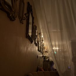 Antique mirrors along the wall
