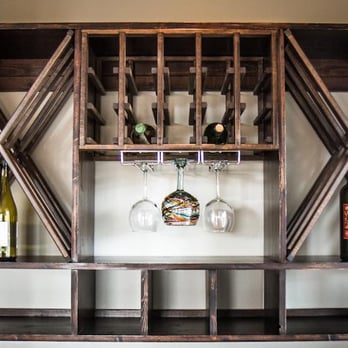Straightedge Construction - a wine rack with wine glasses - General Contractors Near Me - Missoula, Montana Straightedge Construction - a wine rack with wine glasses - General Contractors Near Me - Missoula, Montana