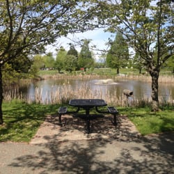 City of Delta - Pond and park bench beside building~