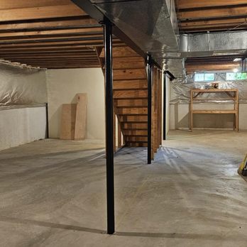 Basement Remodeling - Before: View standing from wet bar area - General Contractors Near Me