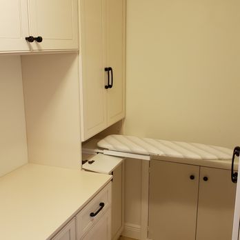 Artisan Closets and Trim Inc. - pull out ironing board in custom Laundry room cabinet - General Contractors Near Me - Dunedin, Florida Artisan Closets and Trim Inc. - pull out ironing board in custom Laundry room cabinet - General Contractors Near Me - Dunedin, Florida