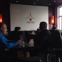 a group of people sitting at a table a group of people sitting at a table