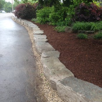 Nu Image Property Maintenance - a stone retaining wall - Snow Removal Near Me - Guelph, Ontario Nu Image Property Maintenance - a stone retaining wall - Snow Removal Near Me - Guelph, Ontario