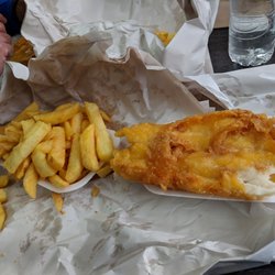 Flash In The Pan - Half eaten cod from fish and chips combo meal.
