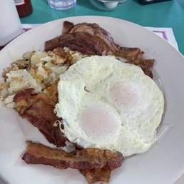 Eggs, over easy with bacon and hash browns.