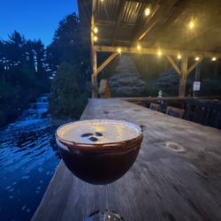 Pizza Chef of Quechee - Nights out back in the Beer Garden with a view of the miniature Golf's waterfall and covered bridge!