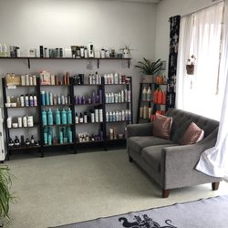 Elegant Hair Designs - Waiting area and retail products