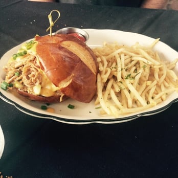 Moonshine Grill - 3 way pork sandwich with cold shoe string fries. - Southern Near Me - Austin, Texas Moonshine Grill - 3 way pork sandwich with cold shoe string fries. - Southern Near Me - Austin, Texas