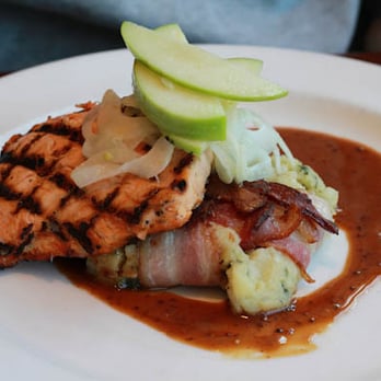 Oceano Bistro - Grilled Atlantic Salmon with bacon-wrapped potato cake - Seafood Near Me - Clayton, Missouri Oceano Bistro - Grilled Atlantic Salmon with bacon-wrapped potato cake - Seafood Near Me - Clayton, Missouri