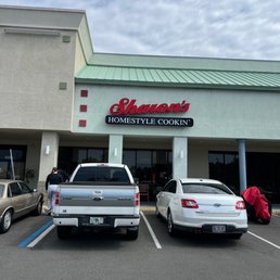  cars parked in front of the store