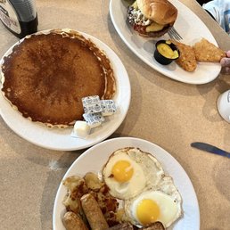 a breakfast of pancakes, eggs, toast, and pancakes a breakfast of pancakes, eggs, toast, and pancakes