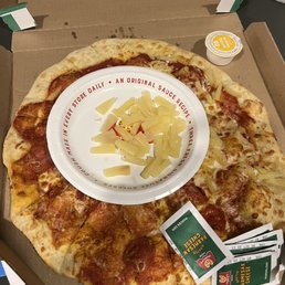 a pizza with a smiley face on it a pizza with a smiley face on it