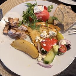 Red snapper, lemon potatoes, watermelon salad, mad chef salad, pita bread, and Italian bread