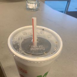 a drink in a plastic cup with a straw a drink in a plastic cup with a straw