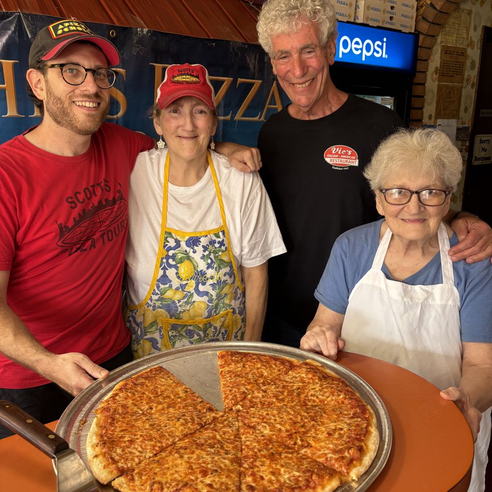 With Scott and mother/daughter owner of John's Pizzeria in Elmhurst, Queens. With Scott and mother/daughter owner of John's Pizzeria in Elmhurst, Queens.