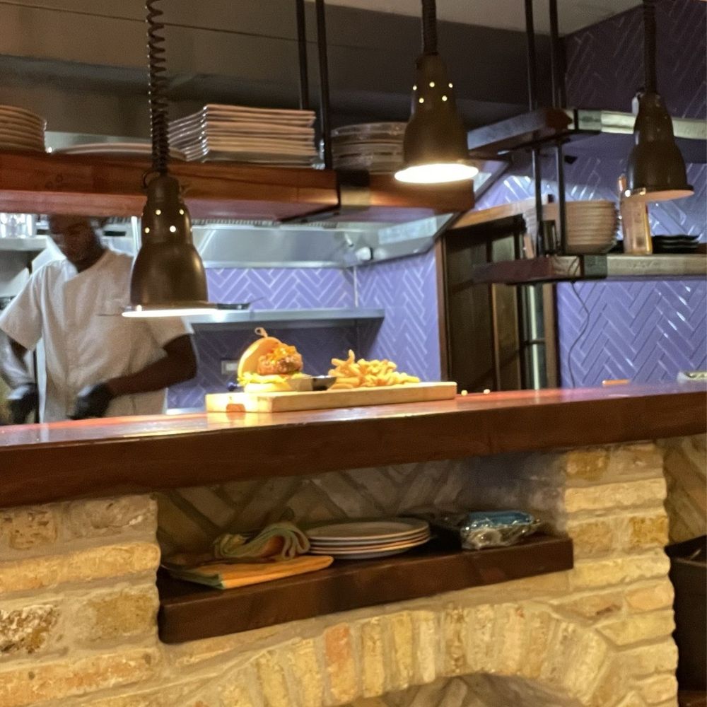 Hamilton’s - Open kitchen with Burger on counter - American Near Me - Christiansted, Virgin Islands Hamilton’s - Open kitchen with Burger on counter - American Near Me - Christiansted, Virgin Islands